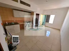 For annual rent: studio with a balcony in Al Rawda 1, next to Al Hamidiya Police Station.