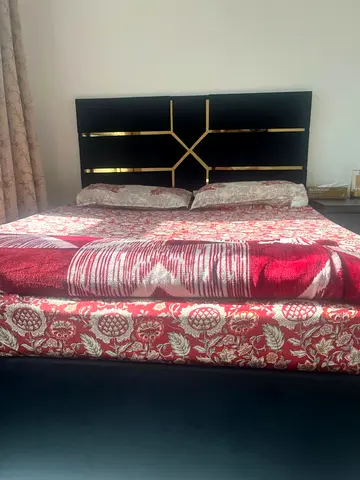 Stylish Queen Size Bed along and an Elegant Headboard