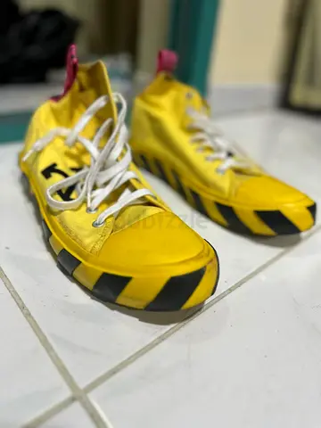 Arrows Off White Yellow and Black Mid Top Sneakers designed by Virgil Abloh