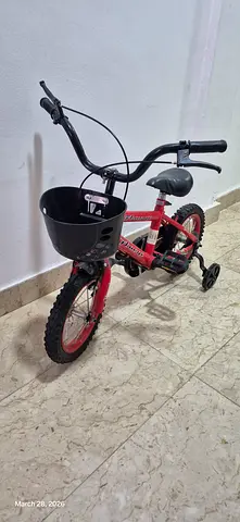 Kids red bike with training wheels and front basket, good condition, slightly used only, ready to pi