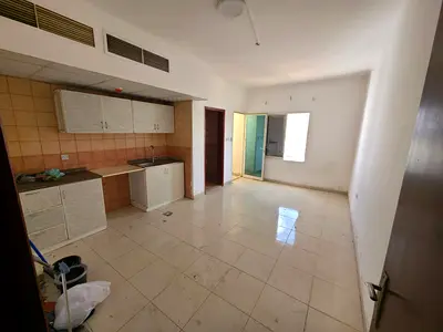 Cheapest studio apartment in Rawdah with balcony, central air conditioning, family accommodation, free maintenance, prime location and service.