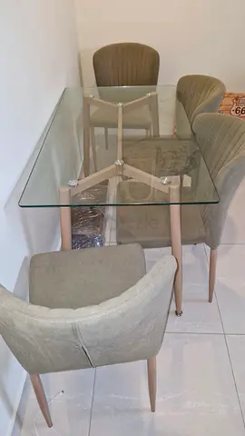 Modern Glass Dining Table with Plush Chairs
