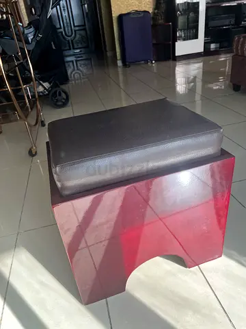 Compact wooden ottoman / footstool with padded cushion