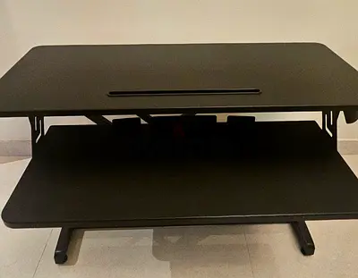 Tired of sitting all day? Grab this preloved Standing Desk Converter - Ergonomic and Space-Saving