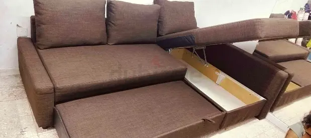 Im selling my brown L-shaped sofa bed with storage