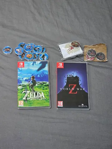 Nintendo Switch games - Zelda: Breath of the Wild  World War Z with amiibo tokens