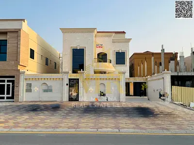 Villa for sale, all-inclusive (electricity, water, and air conditioning), on the main street, ready to move in, in one of Ajman's most prestigious are
