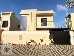 A luxurious villa with a modern design and super deluxe finishing, located in the Al Zahia area in a