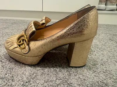 Gucci metallic gold leather fringe loafers (womens) size 39