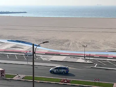 For annual rent in Ajman Corniche, a two-bedroom apartment with a living room is available. Located directly on the Corniche, it boasts excellent sea