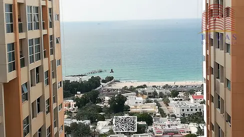 Two bedrooms, a spacious living room, and a sea view