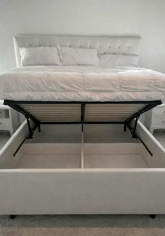 My white upholstered ottoman storage bed with lift-up storage