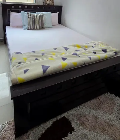 Stylish Wooden Bed Frame with Cozy Bedding