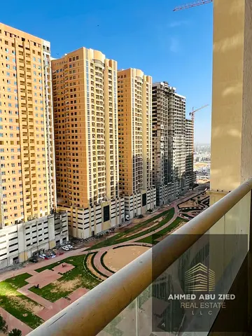 2-bedroom + living room apartment in Emirates City on Sheikh Mohammed Bin Zayed Road, master bedroom, 2 baths, balcony, built-in wardrobes, central AC