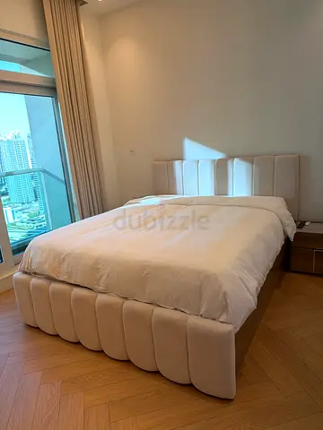 Bed with mattress and side tables