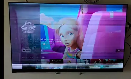 My wall-mounted LED flat-screen TV — screen has horizontal colored lines (needs repair/for parts)