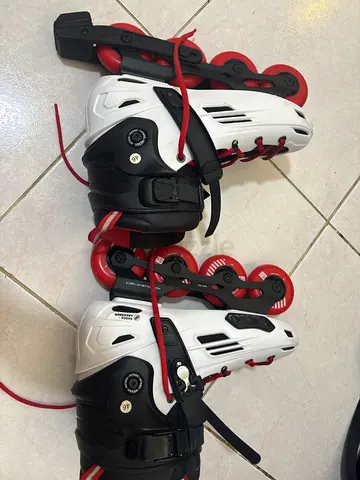 Pair of inline rollerblades (white  red) — used, good condition