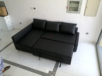 Black L-Shaped Sofa with Pull-Out Bed