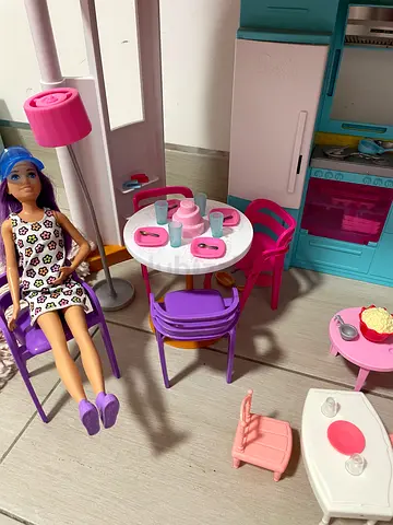 A big Barbie doll house with kitchen, numerous miniature accessories, ken, kids (toys R us)