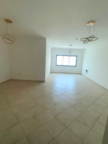 Spacious three-bedroom family apartment with small balcony and central AC in Al Nabaa, Sharjah, near main street and all services.