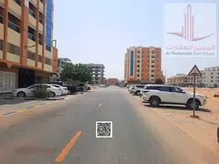 Residential/commercial land in Al-Jarf, on an asphalt road behind the Chinese market. Prime location