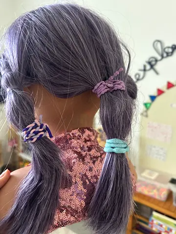 Purple-Haired Doll with Fun Hairstyles