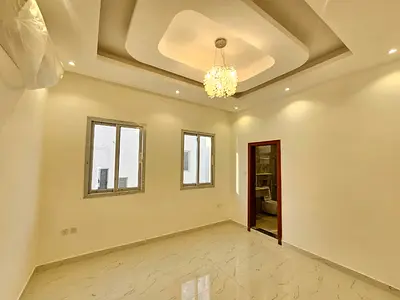 A distinctive villa for rent in Al Zahia, Ajman, featuring 5 master bedrooms, a large family room, a separate majlis (formal sitting room), a well-equ