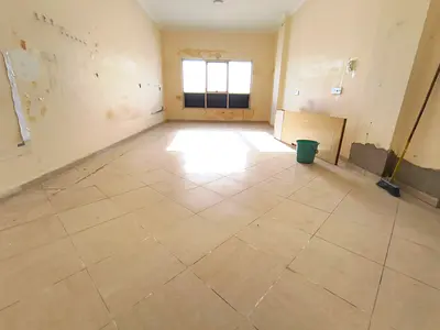 BIG SIZE ON ROAD BUILDING 2 BEDROOM HALL CLOSE TO SCHOOLS FOR FAMILY ONLY READY TO MOVE 45K 4 CHEQUES ONLY