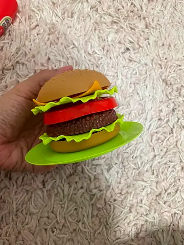 My childs pretend play hamburger toy and complete kitchen set with various accessories.