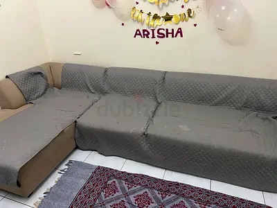 Comfortable L-shaped Sofa with Covers good condition for sale