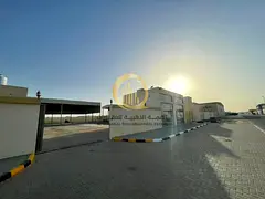 A plot for sale in Al-Sajaa Industrial Area, Al-Jaleel. Land area: 14,000 sq ft. Consists of an offi