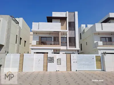 Villa for sale at ajman|Al Bahia area|5 master rooms,majlis, 2 halls, maid room, roof|freehold | 0 registration fees.