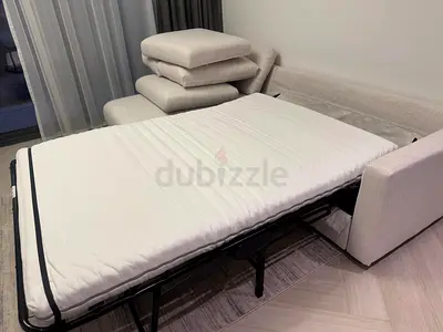 IKEA beige color sofa bed with storage