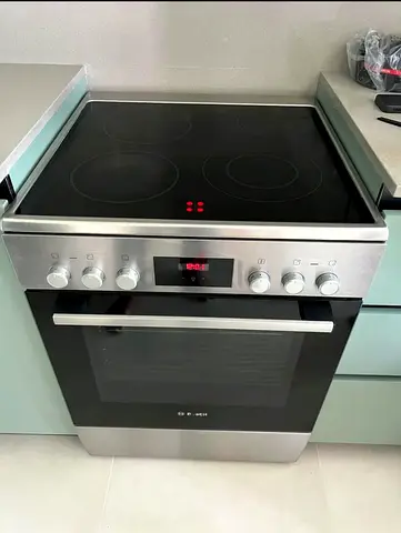 bosch brand 4 burner latest model like new condition perfect working digital display more details co