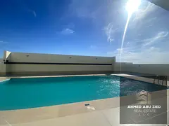 Two master bedrooms and a living room for annual rent in Emirates City, prime location with swimming