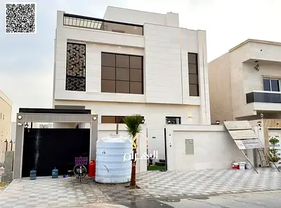 uxury villa for sale in Al Bahia area, featuring two floors and a rooftop terrace. Modern design, spacious layouts, reception areas,