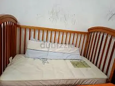 Wooden baby crib with mattress (used)