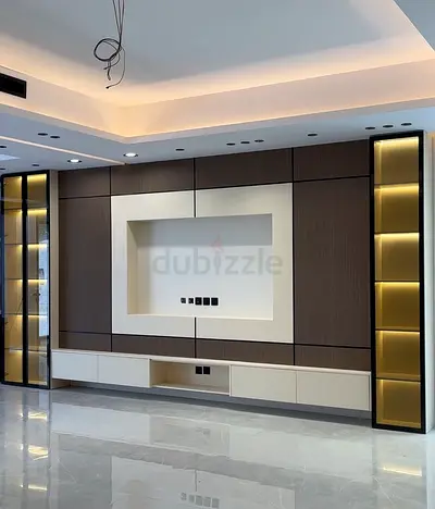 Tv unit with LED-lit display shelves