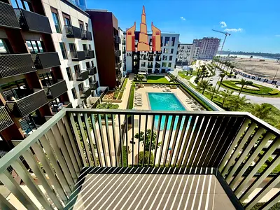 Experience upscale living in a luxurious community – stylish balcony with serene pool views, top-class amenities, and dedicated parking for your comfort