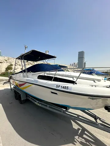 Family and fishing boat