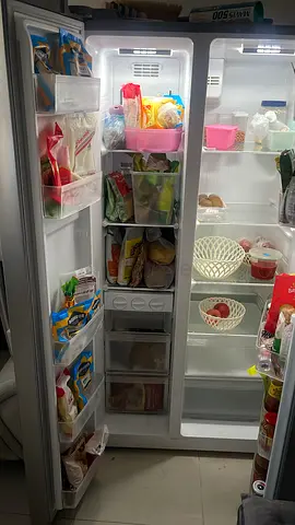 Spacious side-by-side refrigerator and freezer — working well