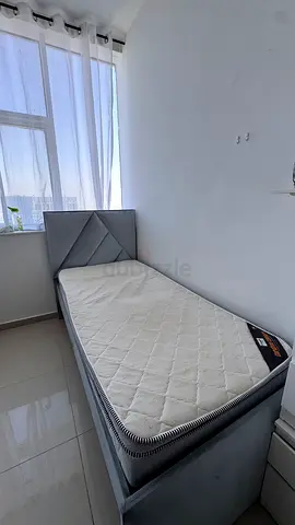 Single upholstered bed with mattress, good condition