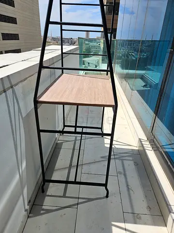 Metal frame ladder bookcase with wooden shelves - good condition. Trade Centre 1. Pick up only.
