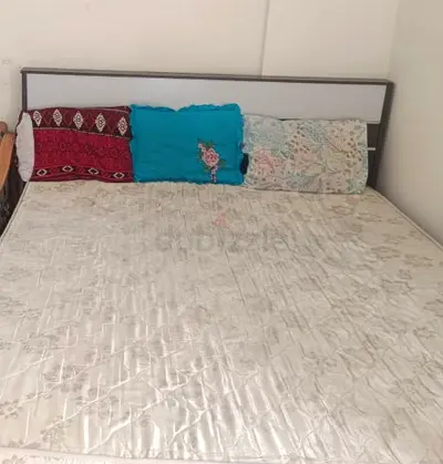 Comfortable Queen Size Bed with Pillows