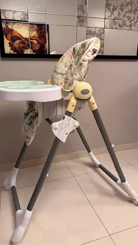 Used baby high chair with adjustable height and removable tray