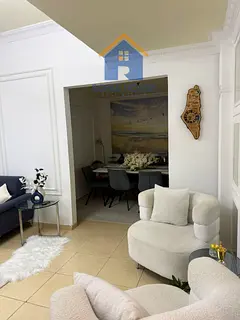 Two bedrooms, a living room, and two balconies with an open view for sale in Al Khan.