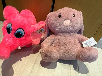 Pair of plush toys: pink elephant and grey bunny