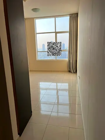 Two bedrooms, a living room, and a balcony are available for annual rent in Ajman, in Orient Towers, with parking.