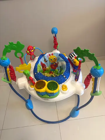 Lightly used baby jumper/exersaucer with interactive toys