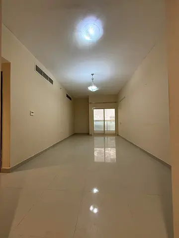 Beautiful room and living room for annual rent in Al Jurf 3, with all amenities, including a master bedroom and parking.